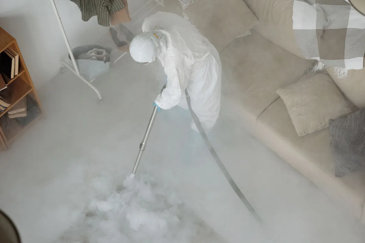 Biohazard cleanup technician in protective equipment, Netarts, OR